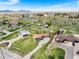 Expansive property showcases a ranch-style home with barns, outbuildings, and mountain views at 13805 W 82Nd Ave, Arvada, CO 80005