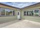 A back patio area with two large windows looking into the home at 13805 W 82Nd Ave, Arvada, CO 80005