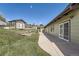 Backyard featuring shed, garden beds, and a grassy lawn at 13805 W 82Nd Ave, Arvada, CO 80005