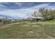 Expansive backyard featuring a large storage shed and plenty of green space at 13805 W 82Nd Ave, Arvada, CO 80005