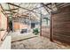 Barn interior with stalls, exposed rafters, and ample storage space at 13805 W 82Nd Ave, Arvada, CO 80005