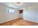 Bedroom with hardwood floors, window, and built in cabinet at 13805 W 82Nd Ave, Arvada, CO 80005
