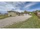Charming single-story home with an oversized two-car garage and a large gravel driveway at 13805 W 82Nd Ave, Arvada, CO 80005