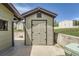 Exterior view of a shed featuring a gabled roof, and horizontal siding at 13805 W 82Nd Ave, Arvada, CO 80005