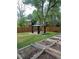 Landscaped backyard featuring a gazebo and raised garden beds, ideal for outdoor living at 1477 S Wright Ct, Lakewood, CO 80228