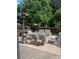 Relaxing backyard deck with patio furniture, heat lamp, and shaded with mature trees at 1477 S Wright Ct, Lakewood, CO 80228