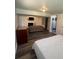 A combined living room and bedroom with wood floors, a fireplace and a cozy bed at 1477 S Wright Ct, Lakewood, CO 80228