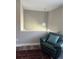 Comfortable loft area with chair, accent pillow, and hanging light fixture at 1477 S Wright Ct, Lakewood, CO 80228