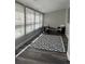 Bright sunroom with lots of windows and a decorative rug and contemporary seating at 1477 S Wright Ct, Lakewood, CO 80228