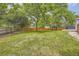 Expansive backyard featuring lush green grass, a charming gazebo, and a sturdy fence, perfect for outdoor activities at 1477 S Wright St, Lakewood, CO 80228