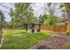 Beautifully landscaped backyard with a gazebo, lush lawn, and privacy fence, offering a perfect outdoor retreat at 1477 S Wright St, Lakewood, CO 80228