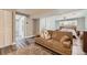 Spacious basement with wood-look floors, open layout, and comfortable sitting area, perfect for relaxing and entertaining at 1477 S Wright St, Lakewood, CO 80228