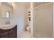 Bathroom featuring glass shower doors, a white toilet, and a single sink vanity at 1477 S Wright St, Lakewood, CO 80228