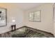 Bright bedroom with hardwood flooring, natural light, and a small accent table at 1477 S Wright St, Lakewood, CO 80228