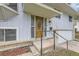 Detailed front entry showcasing a decorative wood door with glass accents and brick detailing at 1477 S Wright St, Lakewood, CO 80228