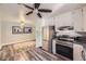 Modern kitchen with stainless steel appliances, gray countertops and hardwood floors at 1477 S Wright St, Lakewood, CO 80228