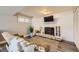 Cozy living room with hardwood floors, a comfortable couch, and a fireplace at 1477 S Wright St, Lakewood, CO 80228