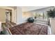 Bright living area with a bay window, comfortable seating, and stylish flooring at 1477 S Wright St, Lakewood, CO 80228