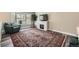 Cozy living room with a modern fireplace, large window, and comfortable seating area at 1477 S Wright St, Lakewood, CO 80228