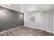 The finished basement has wood grain floors, recessed lighting, and a gray accent wall at 6876 Edgewood Way, Highlands Ranch, CO 80130