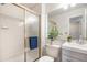 Clean, tiled bathroom featuring a shower with glass doors and a modern vanity at 6876 Edgewood Way, Highlands Ranch, CO 80130