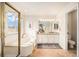 Bright bathroom featuring a separate tub and shower, double sinks, and neutral finishes at 6876 Edgewood Way, Highlands Ranch, CO 80130