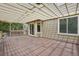 The large, shaded deck looks out to the beautiful backyard at 6876 Edgewood Way, Highlands Ranch, CO 80130