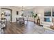 Bright dining room featuring a modern chandelier, a bay window, and stylish decor at 6876 Edgewood Way, Highlands Ranch, CO 80130