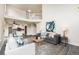 Spacious living room with open floor plan, showcasing the staircase and modern decor at 6876 Edgewood Way, Highlands Ranch, CO 80130