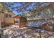 Backyard hammock and hot tub area, perfect for relaxing outdoors at 4560 Flanders Way, Denver, CO 80249