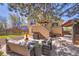 Backyard features comfortable seating, a grill, and outdoor access to a hot tub at 4560 Flanders Way, Denver, CO 80249