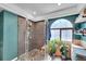 Beautiful bathroom featuring a spacious glass shower, unique window, and indoor plants at 4560 Flanders Way, Denver, CO 80249