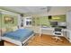 Well lit bedroom with desk area and murphy bed at 4560 Flanders Way, Denver, CO 80249