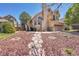 Charming two-story home with a well-manicured front yard and a stone walkway at 4560 Flanders Way, Denver, CO 80249