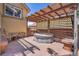 Hot tub on a wooden deck with a pergola at 4560 Flanders Way, Denver, CO 80249