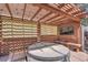 Hot tub under pergola with privacy screening and mounted television at 4560 Flanders Way, Denver, CO 80249