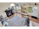 Cozy living room with a black fireplace, modern decor, and large windows for natural light at 4560 Flanders Way, Denver, CO 80249