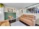 Living room with hardwood floors, accent wall, natural light and modern decor at 4560 Flanders Way, Denver, CO 80249