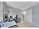 Comfortable office space with a closet, modern desk and neutral colored walls at 4560 Flanders Way, Denver, CO 80249