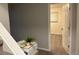 Clean and bright basement hallway with a door leading to an additional room at 1945 W 102Nd Ave, Thornton, CO 80260