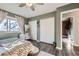 Bedroom with queen bed, closet, and access to hallway at 1945 W 102Nd Ave, Thornton, CO 80260