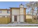 Townhome's front entrance with landscaping and walkway at 1945 W 102Nd Ave, Thornton, CO 80260