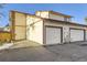 Rear view of the property showing the garage and adjacent units at 1945 W 102Nd Ave, Thornton, CO 80260