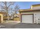 View of a spacious garage with an attached storage area at 1945 W 102Nd Ave, Thornton, CO 80260