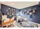 Cozy den or home office with a comfortable chair and built-in shelves at 1945 W 102Nd Ave, Thornton, CO 80260