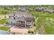 Backyard view of the home, pergola, patio, and surrounding green spaces at 7587 Wright Ct, Arvada, CO 80005