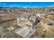 Aerial view of two-story house, detached garage, and large yard at 7587 Wright Ct, Arvada, CO 80005