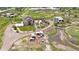 Expansive aerial view of estate featuring a charming home, pond, outbuildings, and pasture at 7587 Wright Ct, Arvada, CO 80005
