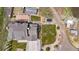 Aerial view of the home with a large yard, mature trees, and multiple outdoor features at 7587 Wright Ct, Arvada, CO 80005