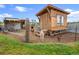 A rustic animal pen with goats, chickens, and a wooden structure at 7587 Wright Ct, Arvada, CO 80005